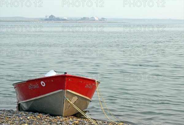 Boat lying on a still water