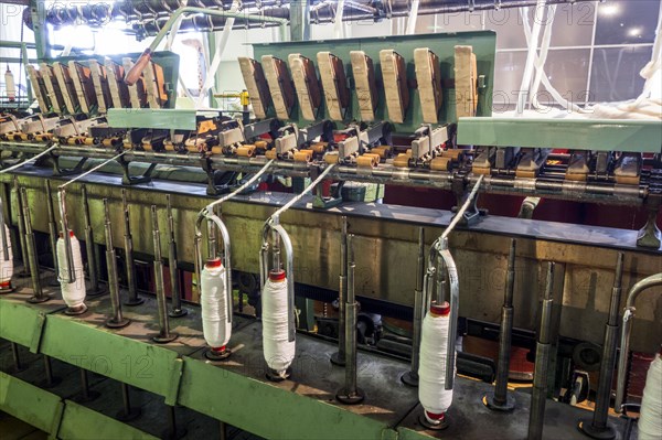 Roving frame machine for drafting the sliver into roving by twisting fibers in cotton mill