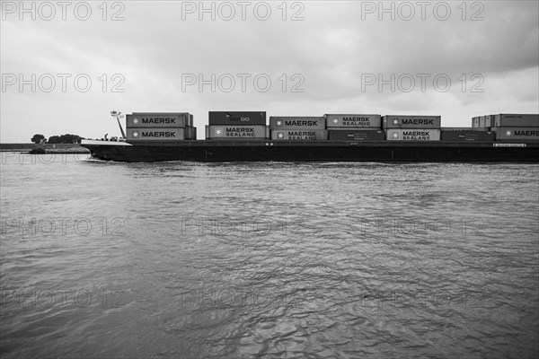 Container ship with loaded containers on the Rhine near Duisburg