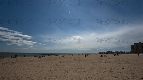 Listening to the ocean waves on a sunny spring day on the Brighton Beach