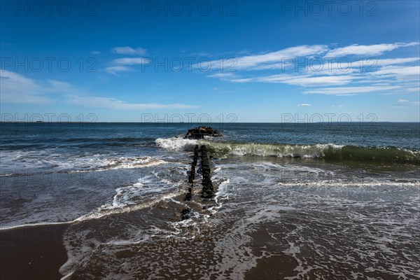 Listening to the ocean waves on a sunny spring day on the Brighton Beach