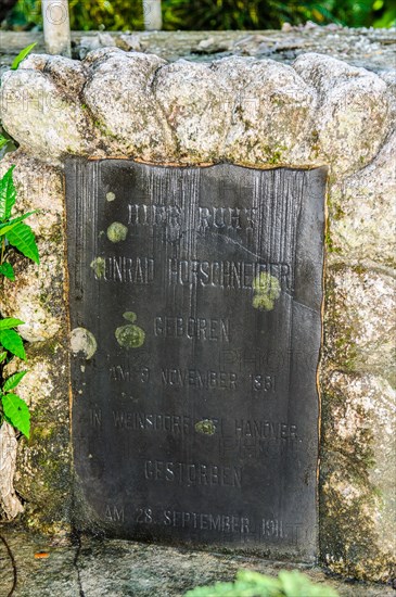 Gravestone from German colonial times Colonial rule in imperial times in Colonia Capital of Yap State on Yap Island with inscription Conrad Hofschneider born 9 November 1881 in Weinsdorf near Hanover died 28 September 1911