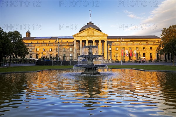 Spa hotel and Casino in late evening light with cascade fountain