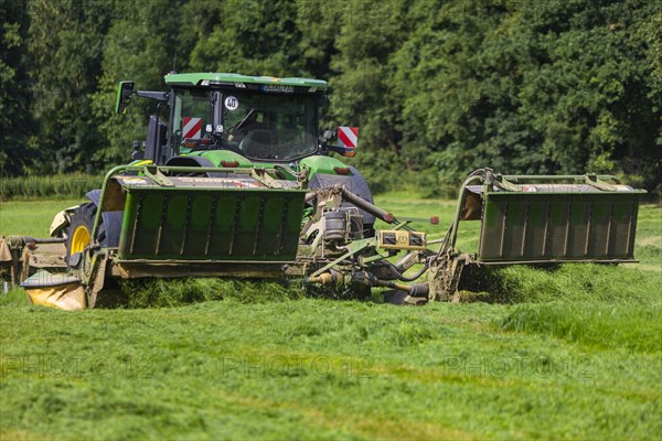 Grass mowing in a small field near Waldheim with a John Deere tractor