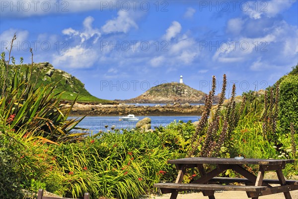View from restaurant terrace of coastline with lighthouse