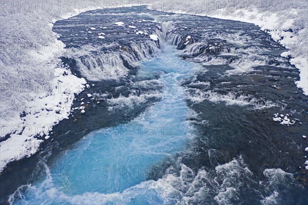 Aerial view over Bruarfoss waterfall in winter