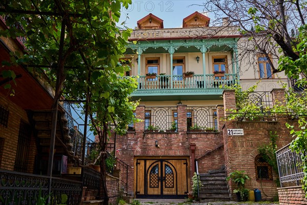 Hotel with renovated historical facade with balcony