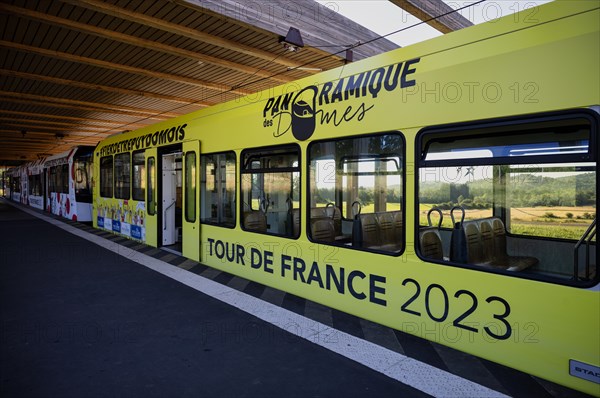 Bottom station of the Panoramique des Domes rack railway in Tour de France 2023 all-car advertising
