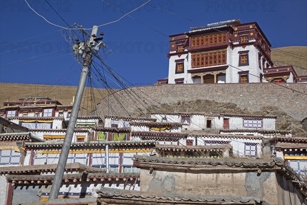 Telephone lines at Tibetan monastery Sershu Dzong in the village Sershu