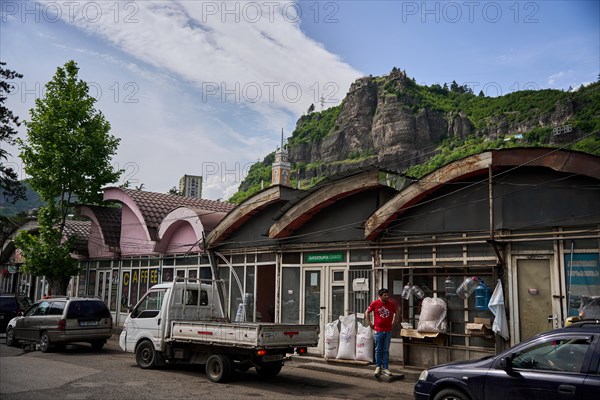 Small shops by the river Qwirila