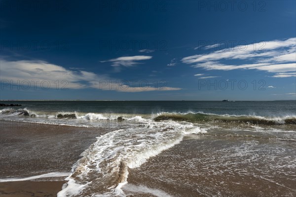 Listening to the ocean waves on a sunny spring day on the Brighton Beach