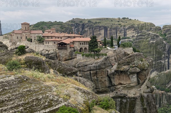 The Meteora Monastery Agia Triada Holy Trinity. The Greek Orthodox Meteora monasteries are built on sandstone cliffs above the Pinios valley. They are a UNESCO World Heritage Site. Kalambaka