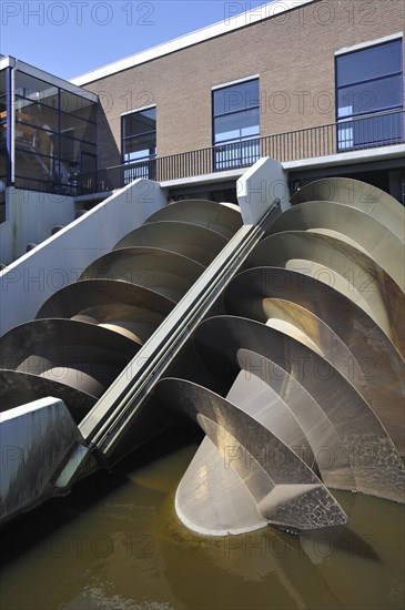 Modern Archimedes screws of pumping station used to drain the polders at Kinderdijk in Holland