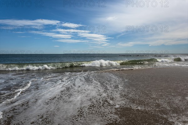 Listening to the ocean waves on a sunny spring day on the Brighton Beach