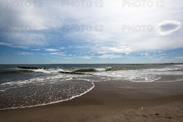 Listening to the ocean waves on a sunny spring day on the Brighton Beach