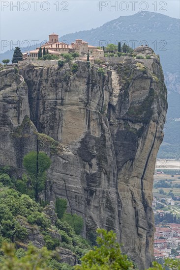 The Meteora Monastery Agia Triada Holy Trinity. The Greek Orthodox Meteora monasteries are built on sandstone cliffs above the Pinios valley. They are a UNESCO World Heritage Site. Kalambaka