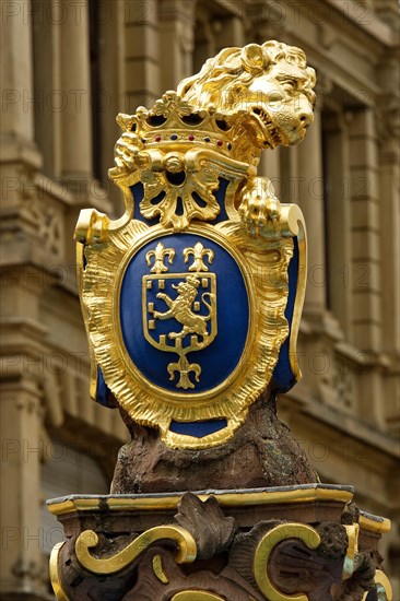 Market fountain with golden Nassau lion with the coat of arms of Wiesbaden