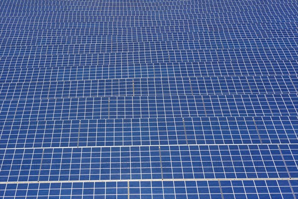 Aerial view over solar panels of photovoltaic power station