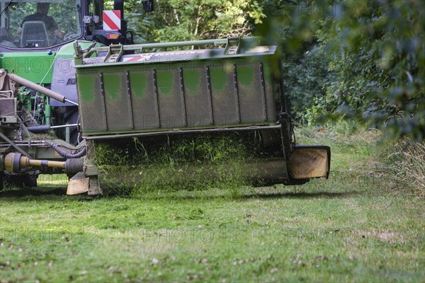 Grass mowing in a small field near Waldheim with a John Deere tractor