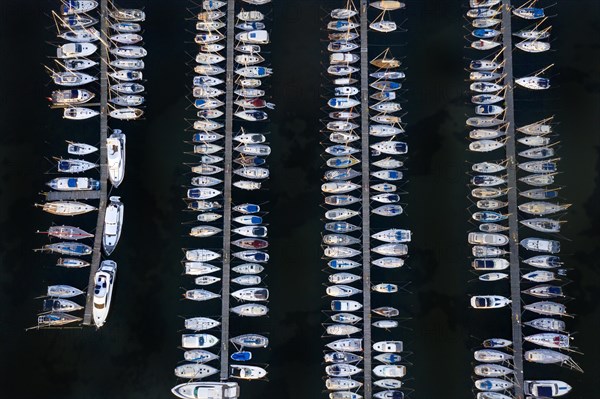 Aerial view over jetties with sailing boats at marina in harbour of Heiligenhafen along the Baltic Sea