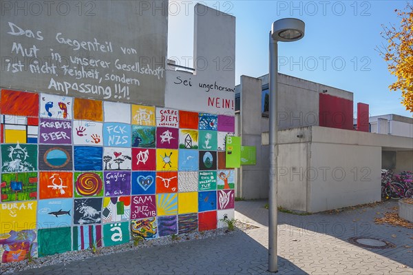 Olympic Village with painting on the former bungalows of the student village