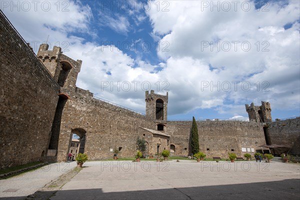 View from courtyard on fortification walls towers watchtowers of castle of Fortezza di Montalcino