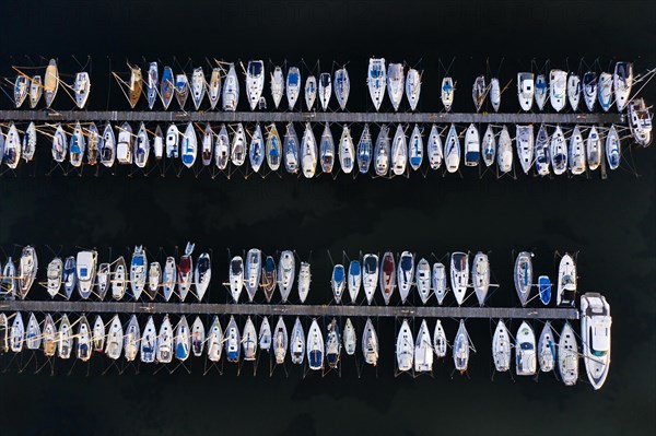 Aerial view over jetties with sailing boats at marina in harbour of Heiligenhafen along the Baltic Sea