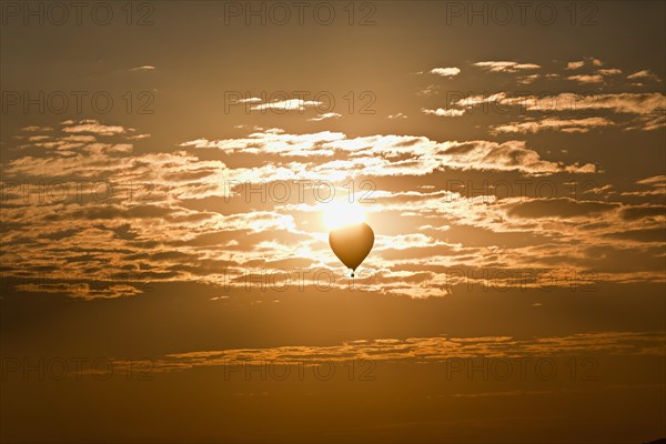 Hot air balloons in the cloudy sky