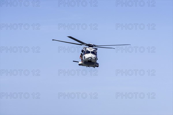 NH90-NFH Caiman NATO Frigate Helicopter of the Belgian Army Air Component in flight during coastal search and rescue mission