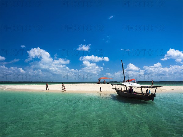 Boat and sandbank in the turquoise sea