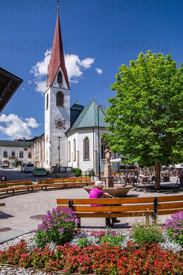 Village square with the pilgrimage church of St. Oswald