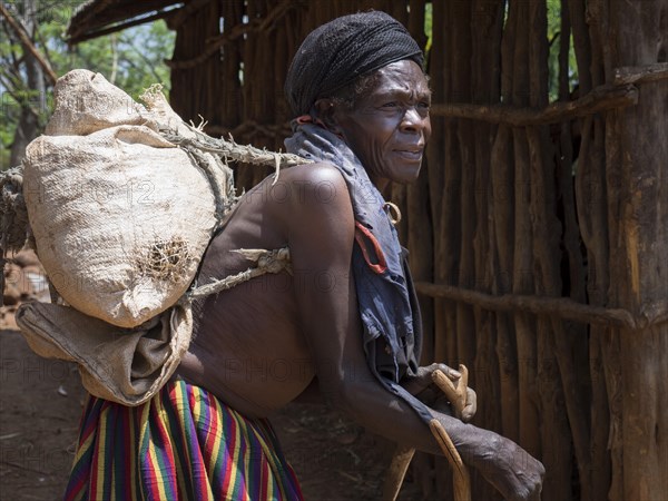 Old woman with sack on her back