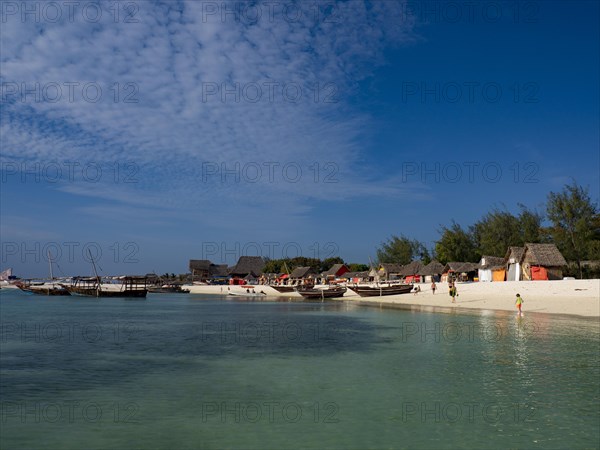 Beach and bay with boats and huts