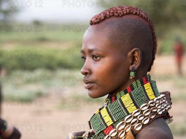 Girl from the Hamar tribe with necklace