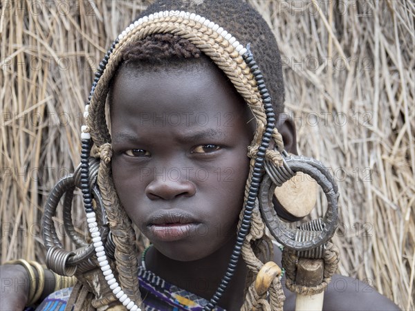 Boy from the Mursi tribe with headdress
