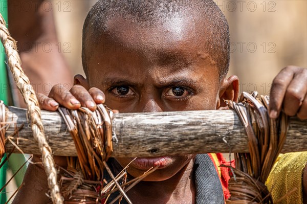 Child in the highlands at a Sing-Sing of the Melpa tribe
