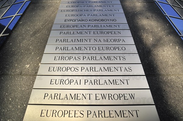 Nameplates of the European Parliament written in different European languages in the Leopold Quarter