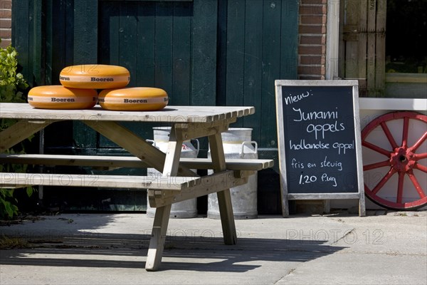 Cheese for sale outside in front of farm in Holland