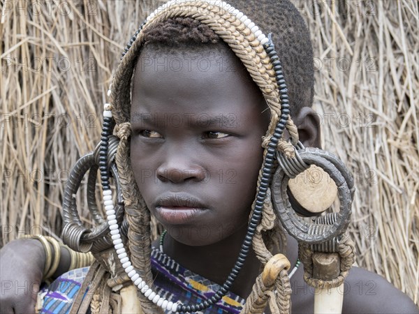 Boy from the Mursi tribe with headdress