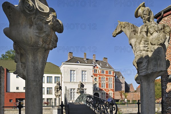 Sculptures of artist Walter De Buck at the Emperor Charles V Bridge over the river Lieve at Ghent