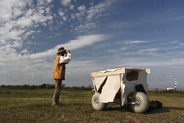 Mobile camouflage hideout of a nature photographer