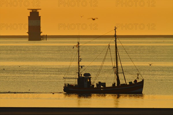 Crab cutter at sunrise in the Weser fairway off Minsener Oog