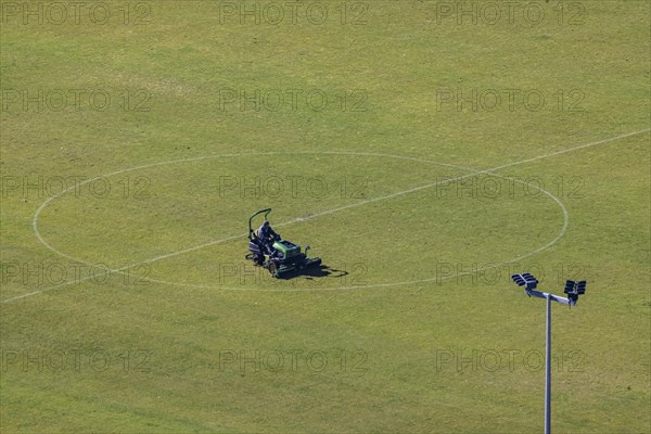 Greenkeeper maintaining the lawn