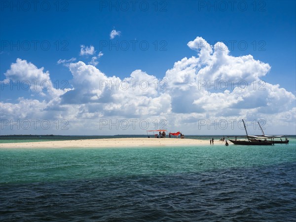 Boats and sandbank in the turquoise sea