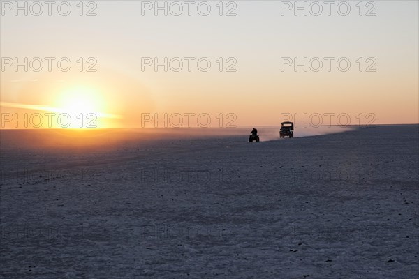 A quad bike and an off-road vehicle