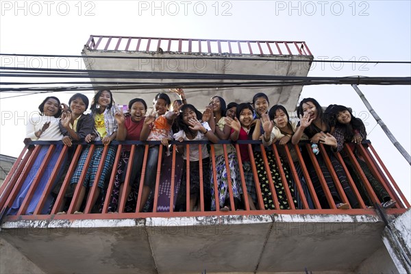 Many people on a balcony