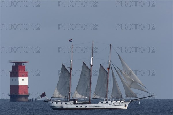 Three-masted barquentine Loth Lorikeeten under sail in the Weser fairway off Minsener Oog