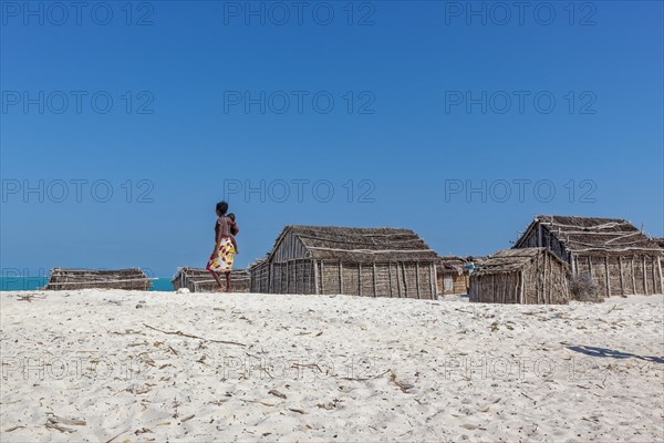 Village with reed huts on the beach