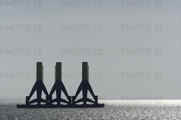 Foundations of offshore wind turbines in tow in the Weser fairway off Minsener Oog