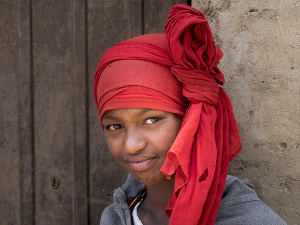 Girl with red headscarf